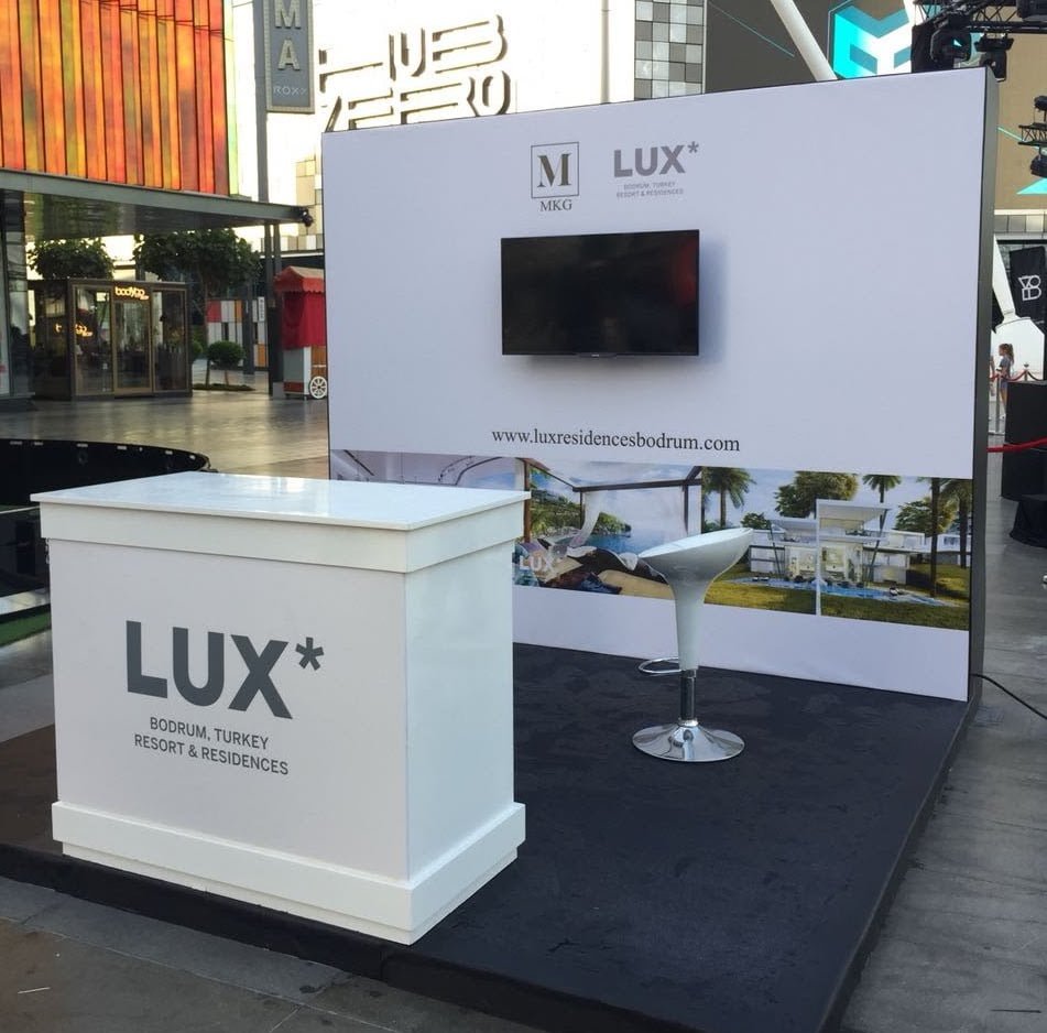 LUX Resorts exhibition stand with counter and display wall